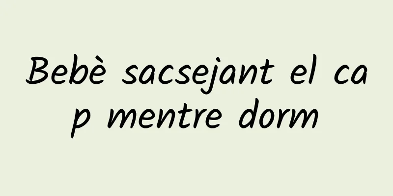 Bebè sacsejant el cap mentre dorm